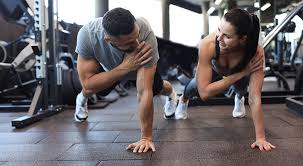 Toning Bingo Wings: Your Ultimate Guide to Sculpting Sleek Arms at the Gym 3 Fitness trainer demonstrating arm toning exercises Scottish