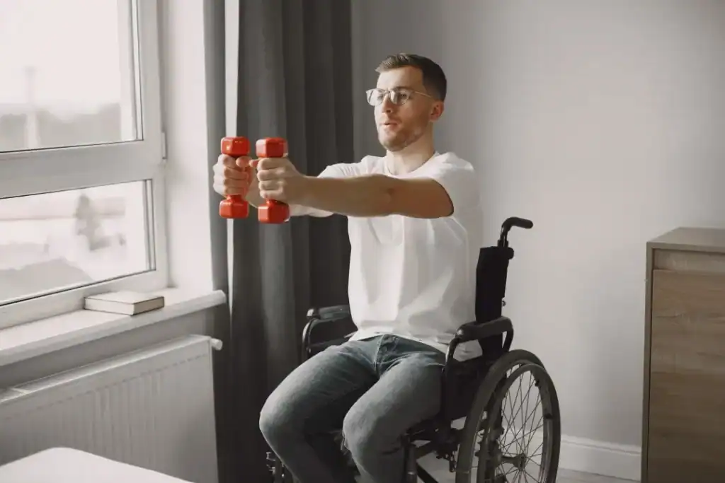 Image of man doing exercise in his wheelchair to aid weight loss Scottish